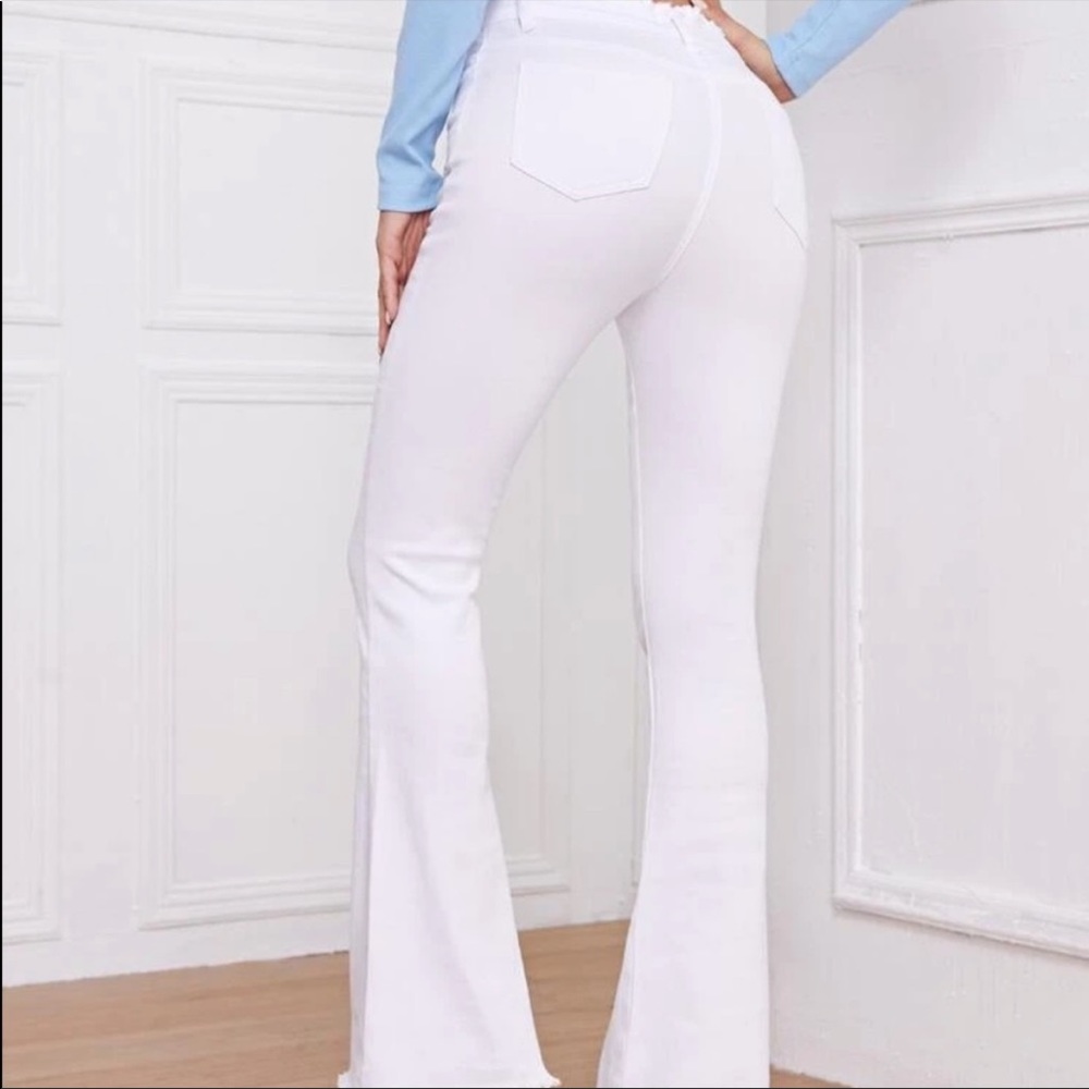 White flare pants with lace up detail